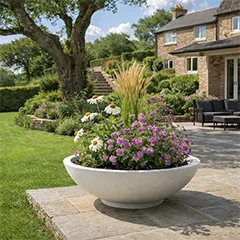 Fiberglass planters in a stylish outdoor space with a modern finish