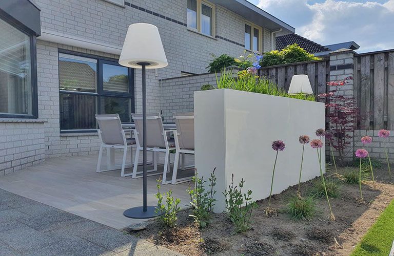 Create cozy corners with terrace divider planter boxes.